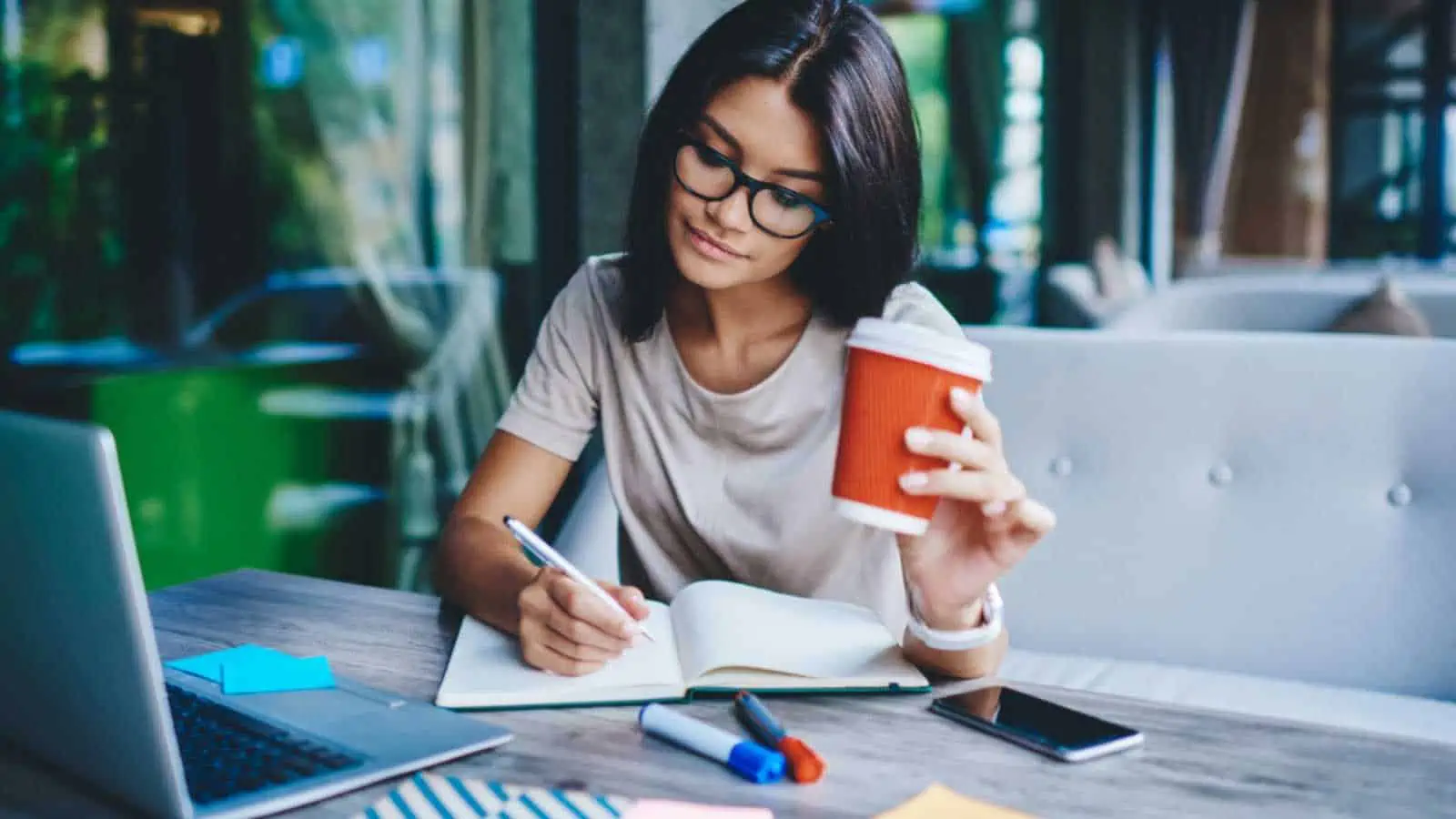 Woman writing and working