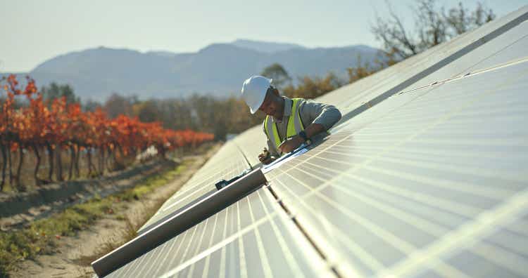 Black man, engineer or solar energy management in electricity sustainability, solar panels or sun grid plant. Worker, employee or technician on renewable energy farm, biodegradable environment or eco