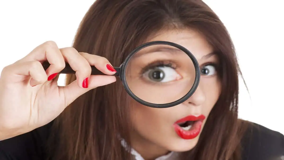 woman using magnifying glass