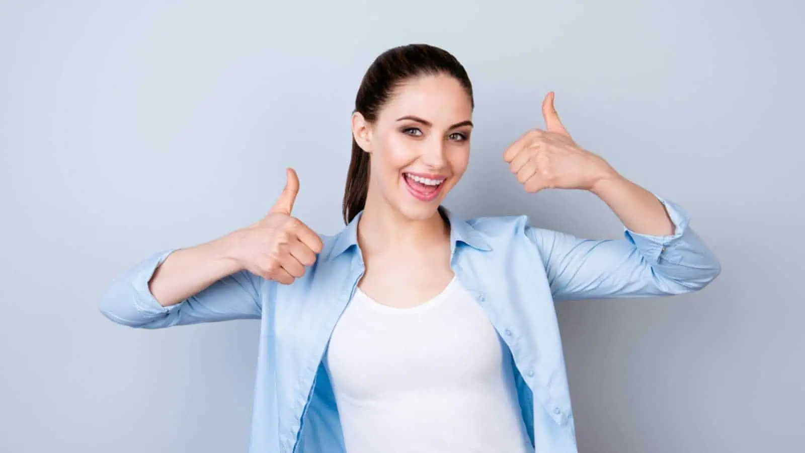 Woman showing thumbs up