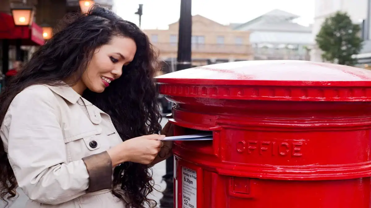 woman mailing post cards