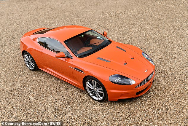 Each of the Orange Collection Aston Martins are painted a special-order shade bespoke to the vendor and come with matching leather interiors. They are set to sell for around £100k each. Pictured: 2010 Aston Martin DBS Coupe