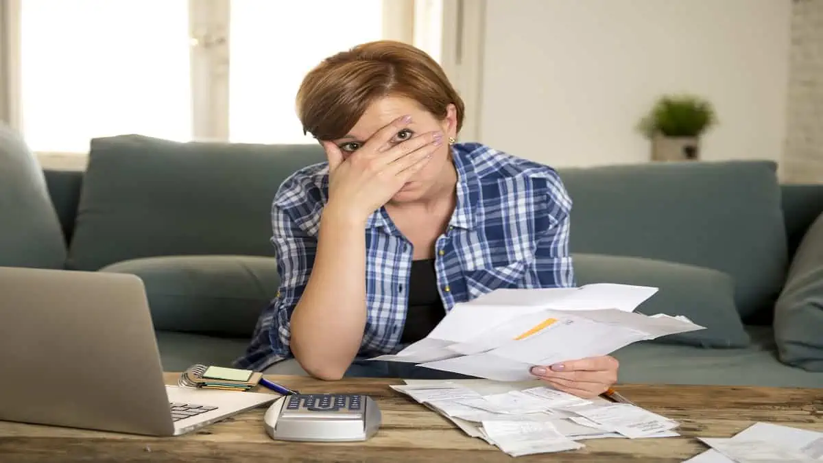 stressed woman covering face