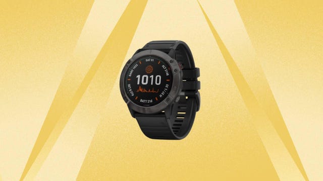 The Garmin fenix 6X Pro Solar Edition GPS Smartwatch is displayed against a yellow background.