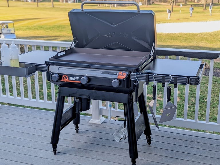 Flat top griddle with golfers in the background