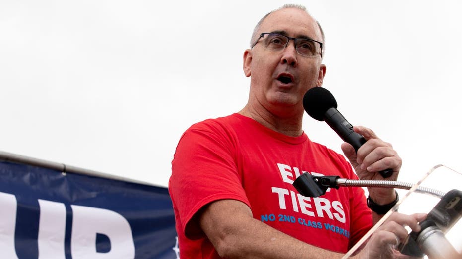 UAW president Shawn Fain speaks at a rally