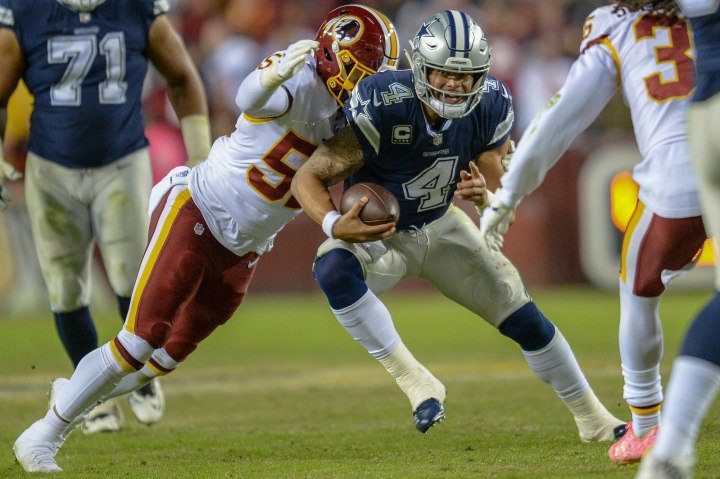 Dak Prescott gets tackled from behind.