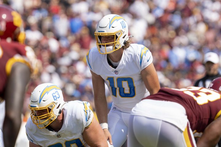 Justin Herbert stands at the line of scrimmage for the Chargers.