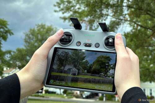 Woman's hands holding the RC 2 remote controller