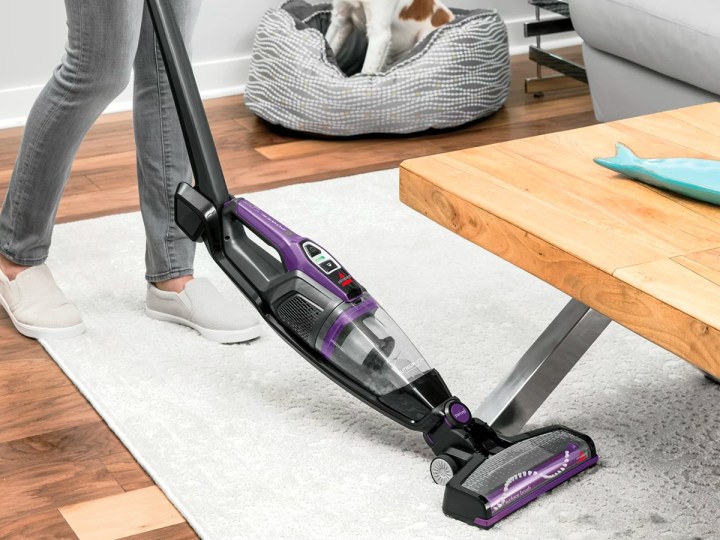 Cleaning under a table with the Bissell PowerLifter Ion 3191.