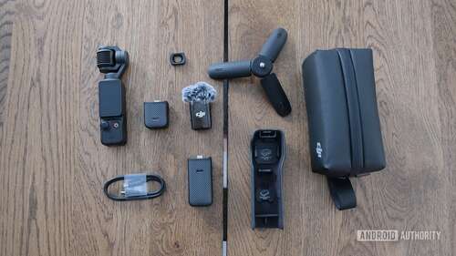 DJI Osmo Pocket 3 with contents of Creator Combo package displayed on a table