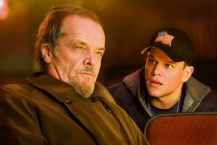 Matt Damon sits behind Jack Nicholson in The Departed.