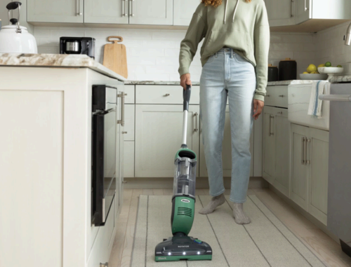 Someone using the Shark Freestyle Pro Cordless Vacuum.