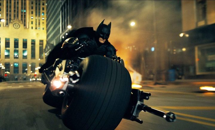 Batman rides his Bat-Cycle in "The Dark Knight."