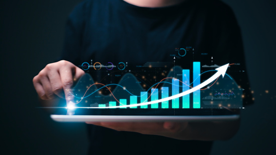 Businesswoman with data analysis and up arrow, Interest rates continue to increase, return on stocks and mutual funds, long-term investment for retirement. Interest rate and dividend concept.