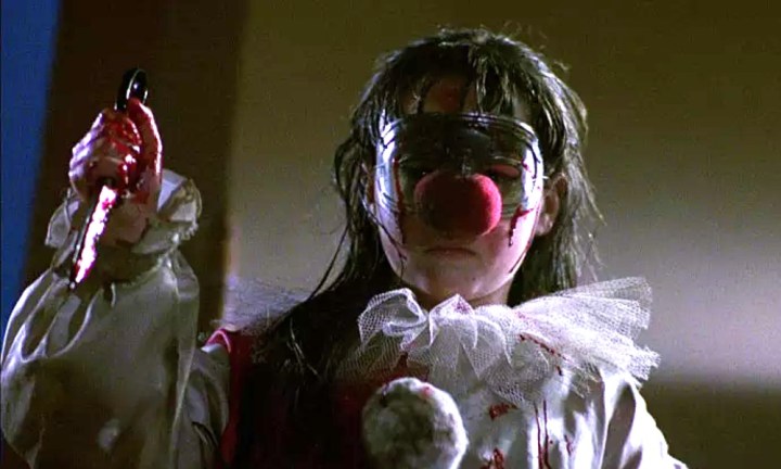 Jamie Lloyd brandishes a knife in her clown costume at the end of Halloween 4