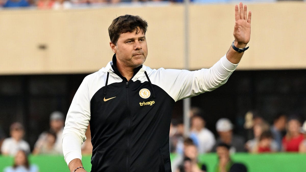 Chelsea Head Coach Mauricio Pochettino waving to supporters.