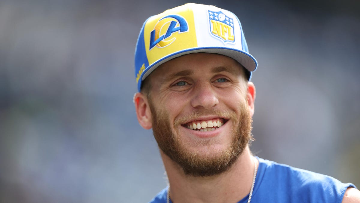 Los Angeles Rams wide receiver Cooper Kupp looking upwards wearing a cap.