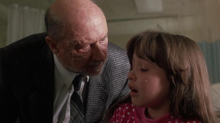 Dr. Loomis looms over Jamie Lloyd in Halloween 5: The Revenge of Michael Myers