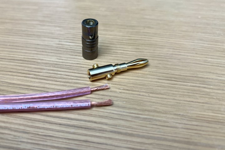 Stripped wire and an open banana plug ready for installation.