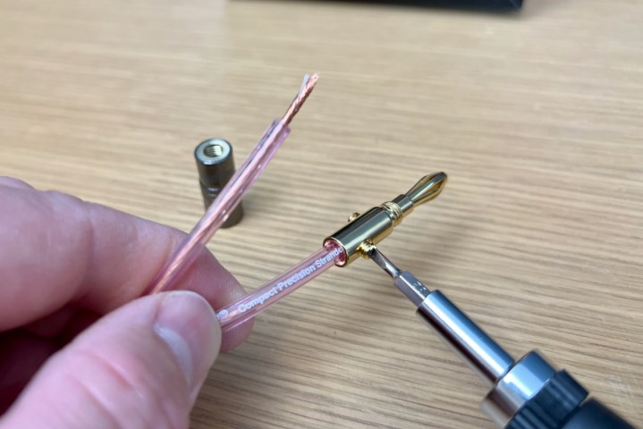 Tightening the screws on a banana plug. 