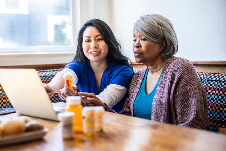 Senior woman having in-home consultation with nurse