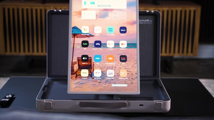 A LG StanbyMe Go monitor in vertical orientation displaying apps. 