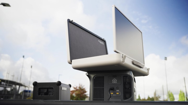 An LG StanbyMe Go briefcase TV open and propped on top of an external battery supply. 