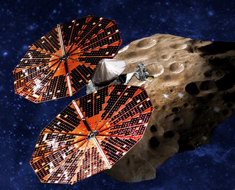 An artist’s conception of the Lucy spacecraft flying by a Trojan asteroid.