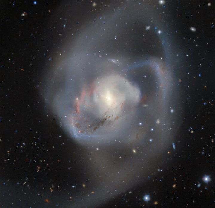 Gemini South, one half of the International Gemini Observatory operated by NSF’s NOIRLab, captures the billion-year-old aftermath of a double spiral galaxy collision. At the heart of this chaotic interaction, entwined and caught in the midst of the chaos, is a pair of supermassive black holes — the closest such pair ever recorded from Earth.