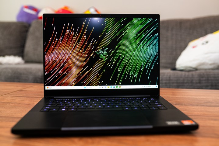 Razer Blade 14 (2023) sitting on a coffee table.