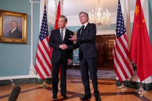 US Secretary of State Antony Blinken shakes hands with Chinese Foreign Minister Wang Yi as they meet at the State Department in Washington