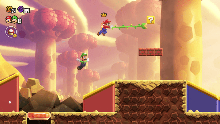 Mario uses a grappling vine in Super Mario Bros. Wonder.