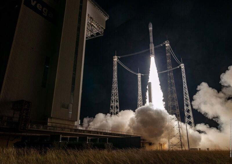 A Vega rocket rides a column of exhaust from its solid-fueled first stage, kicking off a mission to deliver 12 small satellites into orbit.