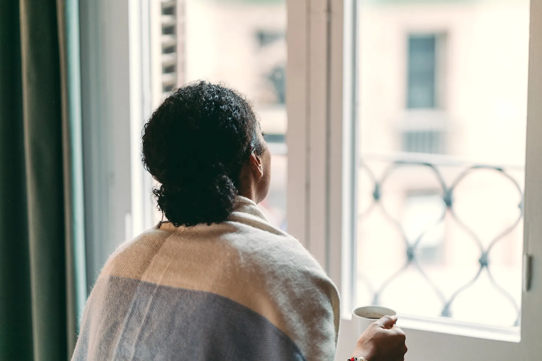 photo of woman at home, drinking coffee