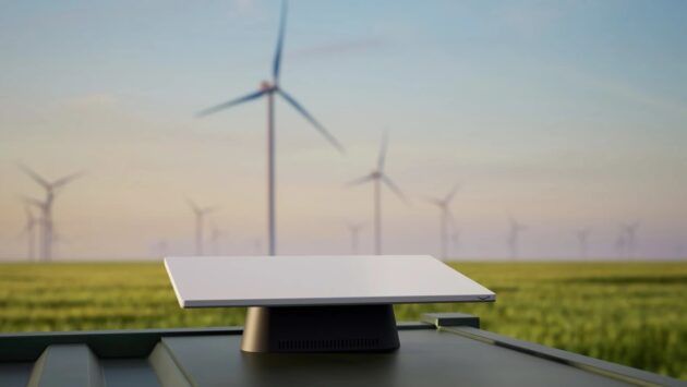 Amazon Project Kuiper satellite terminal with wind farm in background