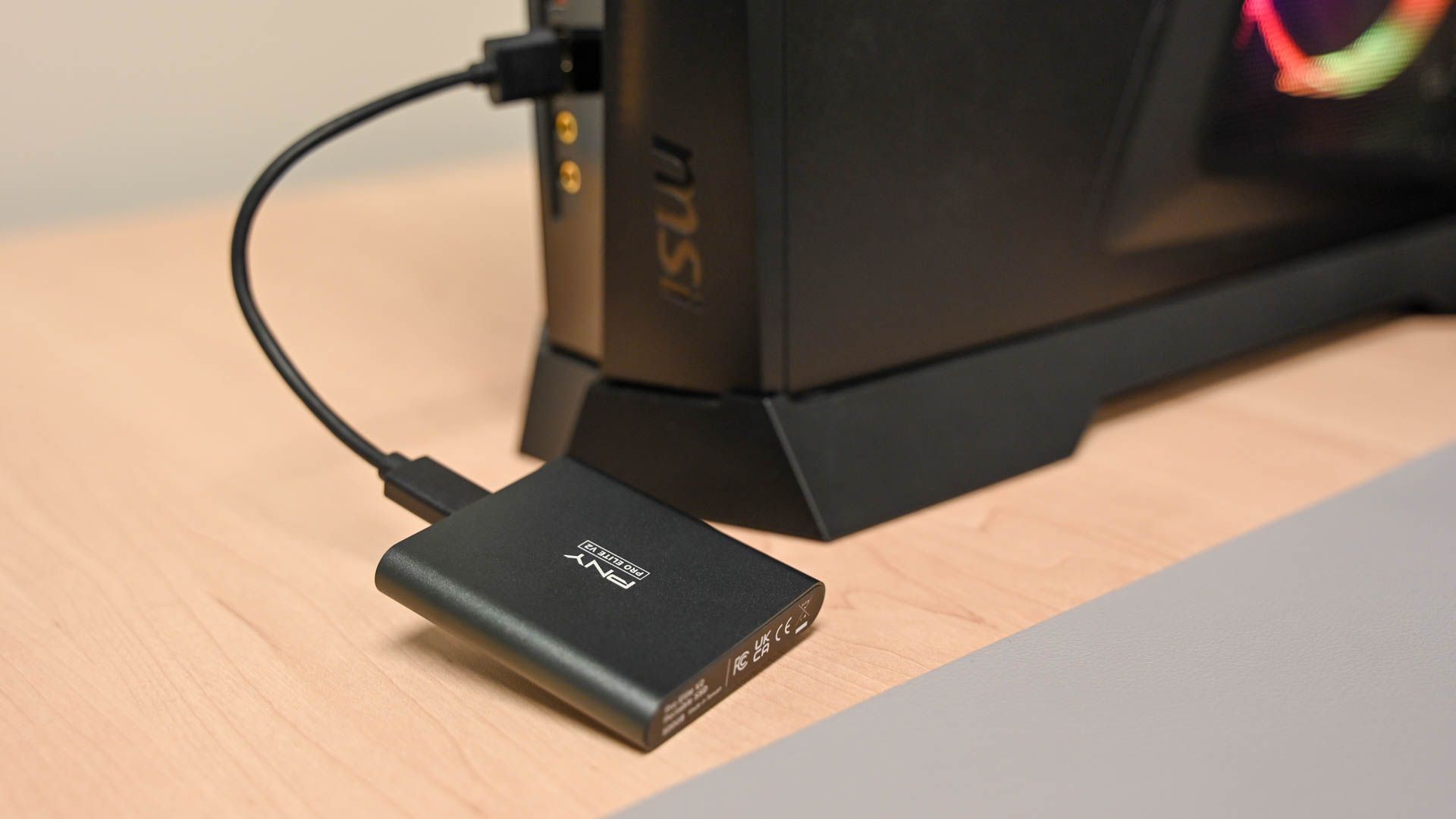 An external SSD plugged into a PC. 