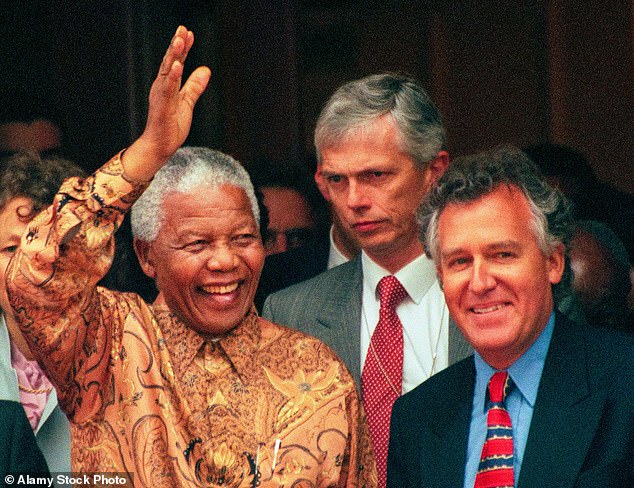 History maker: Peter Hain, far right, with Nelson Mandela in 1998