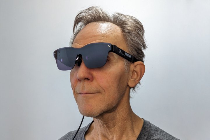 Alan Truly wears the TCL RayNeo Air 2 smart glasses.