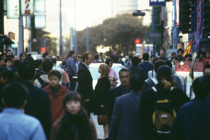 Bill Murray and Scarlett Johansson stand in the street together in Lost in Translation.