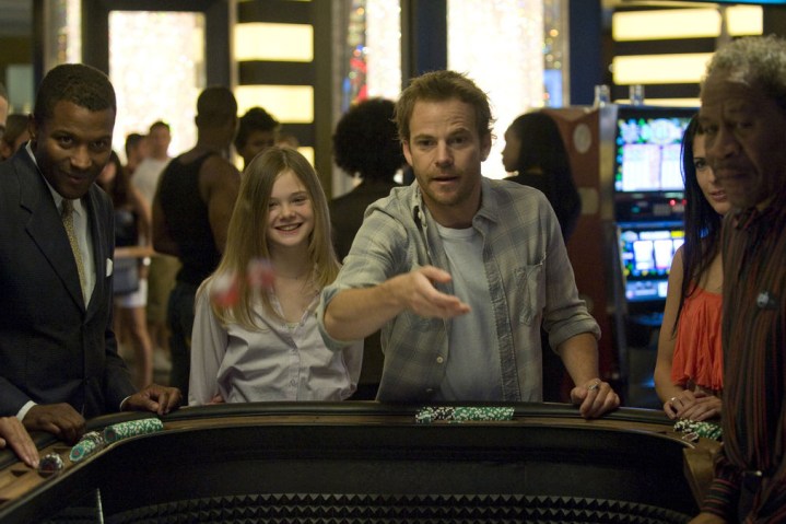 Elle Fanning and Stephen Dorff stand in a casino together in Somewhere.