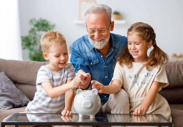 Grandfather helping grandchildren to save money