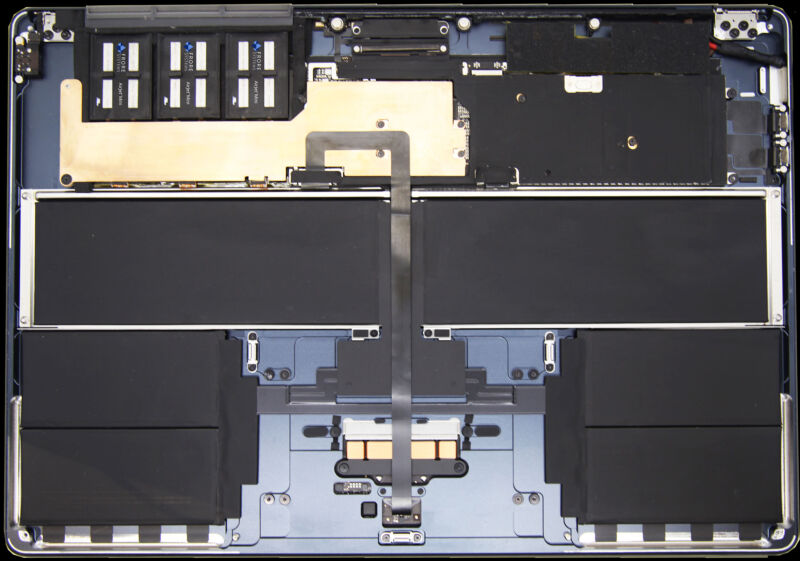 The active cooling chips are labeled and located in the upper-left corner near a custom heatsink in the 15-inch MacBook Air. 