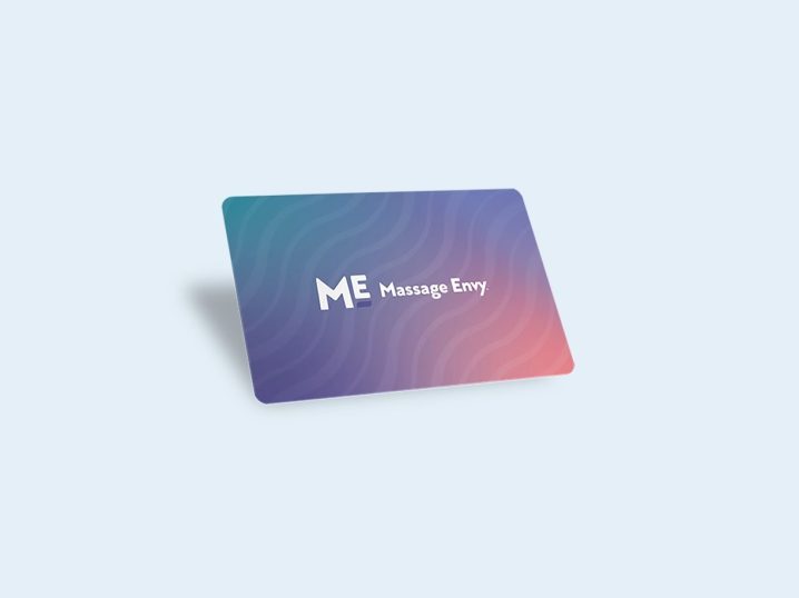 A Massage Envy gift card on a blue background.