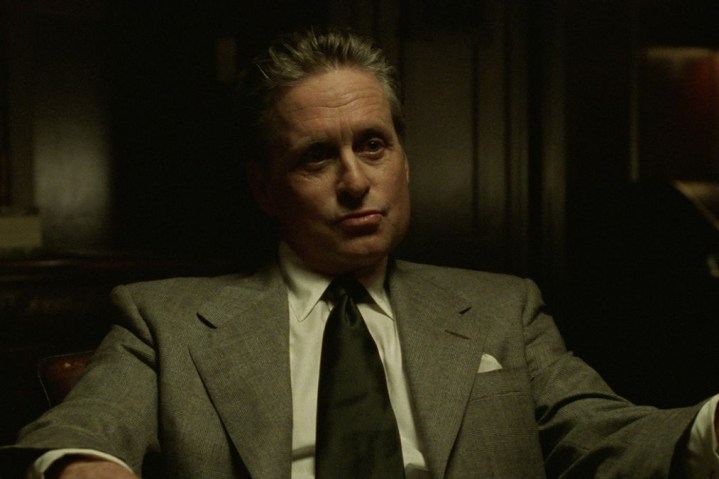 Michael Douglas wears a gray suit in The Game.