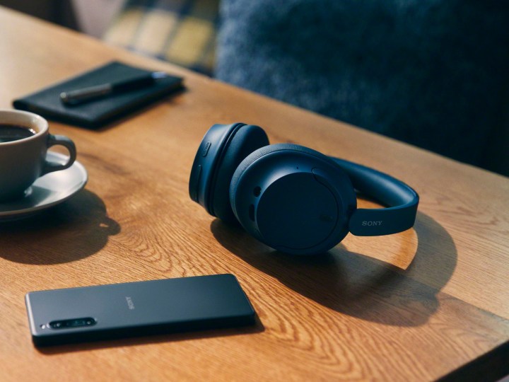 The Sony WHCH720N noise-canceling headphones on a desk.