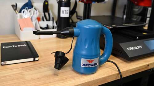 The XPOWER Electric Air Duster with using an adapter and the precision brush tip