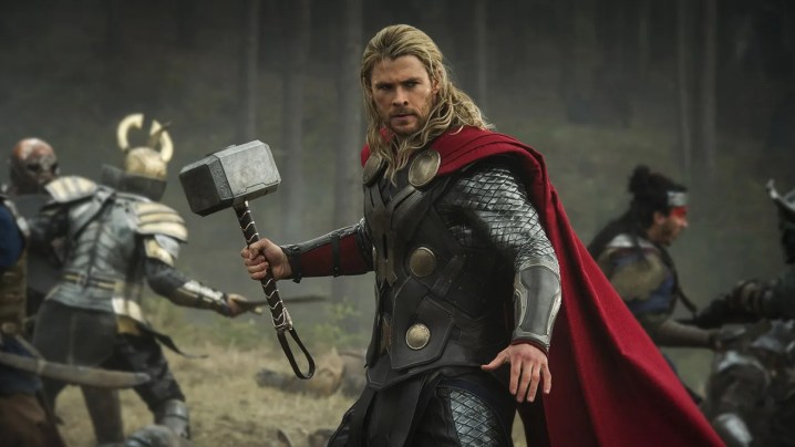 Chris Hemsworth's Thor poses with his hammer.