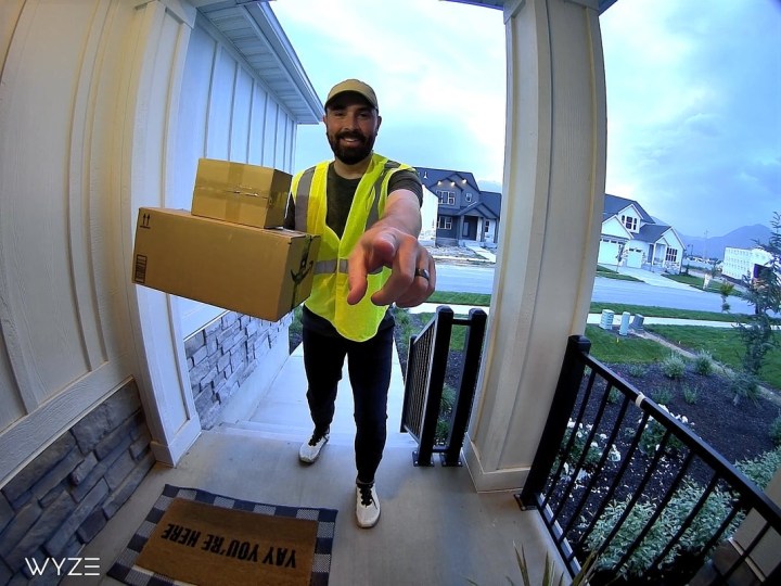 A person approaching the Wyze Video Doorbell v2.