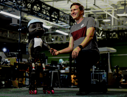 A white man bending down to shake the hand of a child-like robot wearing a white hat and white vest.